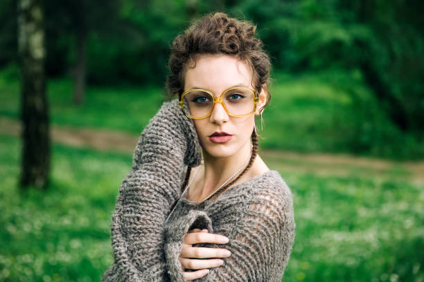 istock Pretty young woman with eyeglasses in the forest 963137766