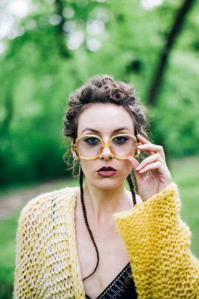 istock Pretty young woman with eyeglasses in the forest 963137866