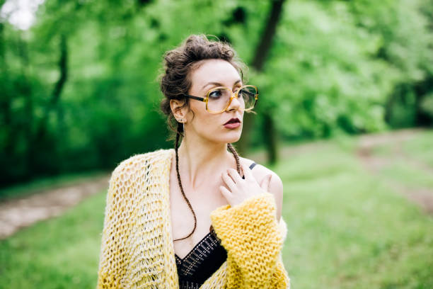 istock Pretty young woman with eyeglasses in the forest 963137870