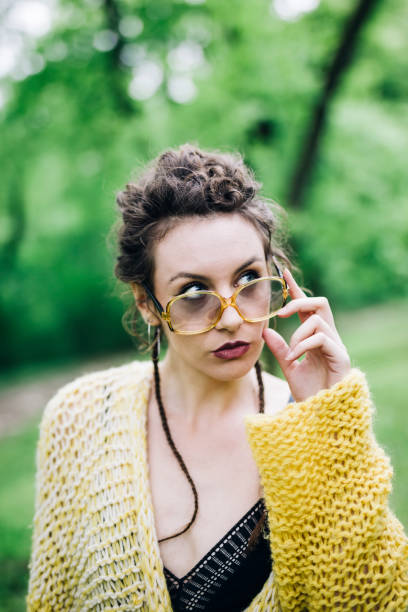 istock Pretty young woman with eyeglasses in the forest 963137878