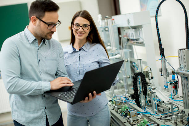 istock Young couple of students at robotics lab 963137954