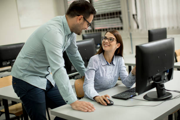 istock Young couple in the classroom 963137962