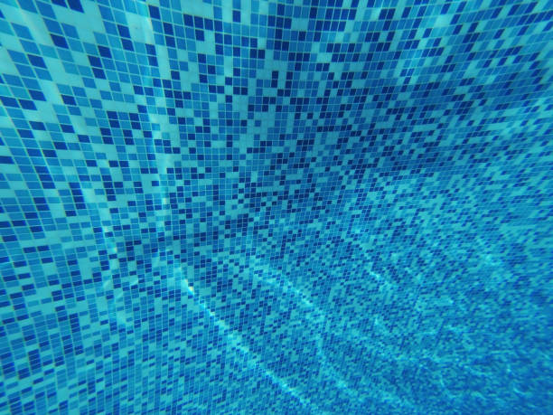 istock Underwater. Beautiful blue background of swimmingpool closeup 963138182