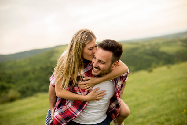 istock Loving coulpe having fun in the spring nature 963140938