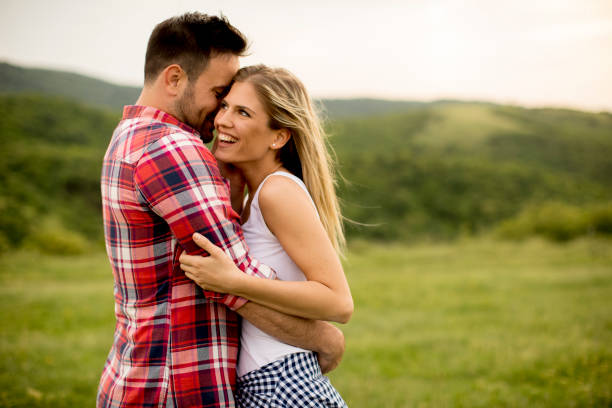 istock Loving coulpe having fun in the spring nature 963140976