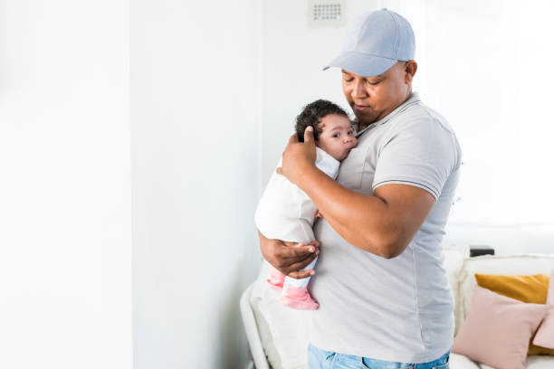 istock Loving father holding baby girl 963141016