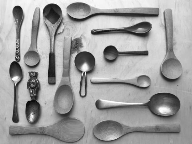 istock Spoon Collection on wooden table top 963145238