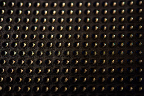 istock Black golden dotted texturised technological seamless fabric or surface closeup 963146492