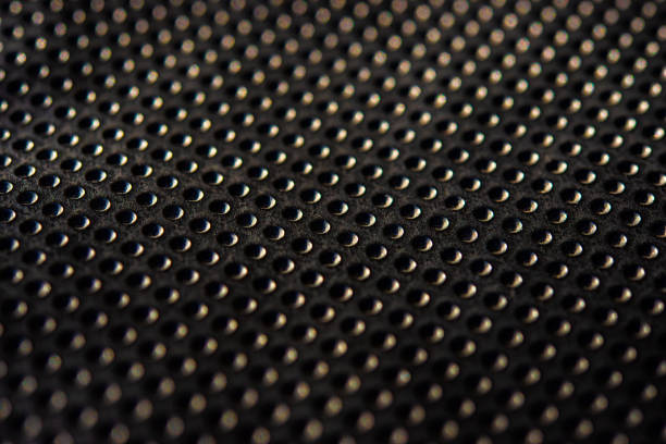 istock Black golden dotted texturised technological seamless fabric or surface closeup 963149414