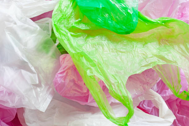istock Colorful plastic bag on cement background 963150956