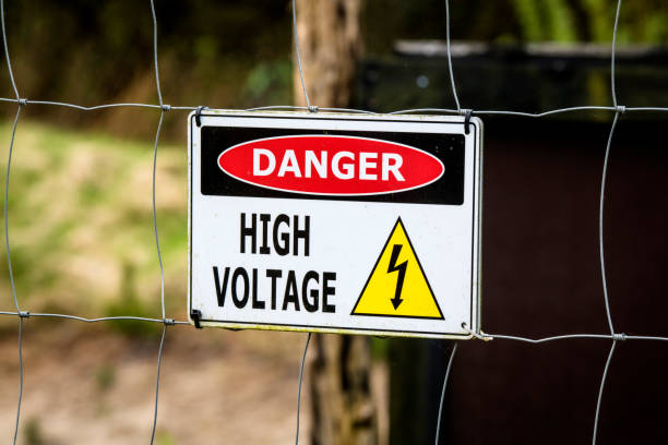 istock High voltage sign on a fence 963151202