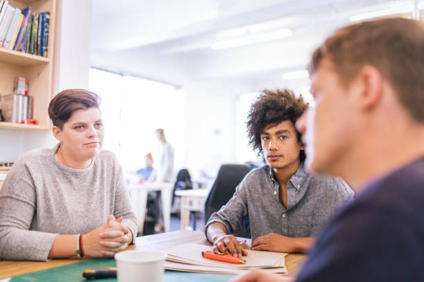 istock Confident young colleagues discussing at office 963151266
