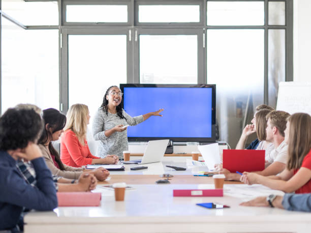 istock Female professional giving presentation at office 963152006