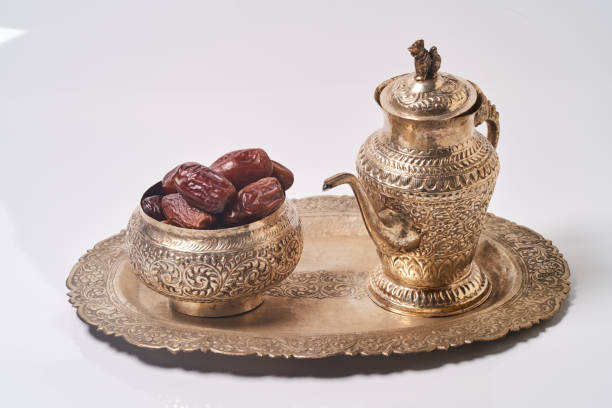 istock sweet dried dates fruit on metal tray on white background 963155070