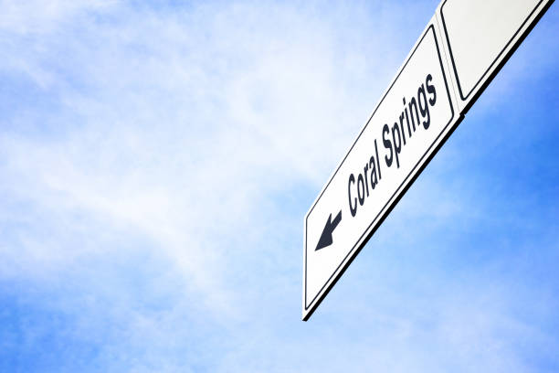 Signboard pointing towards Coral Springs stock photo