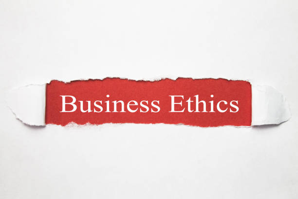 istock Business Ethics words on torn paper. 963160852