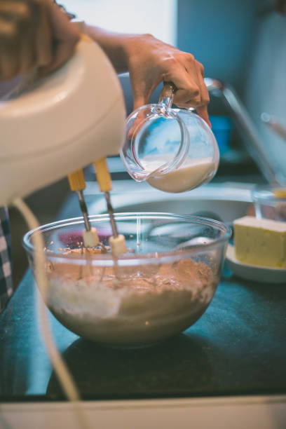 istock happy woman cooking on kitchen 963161302