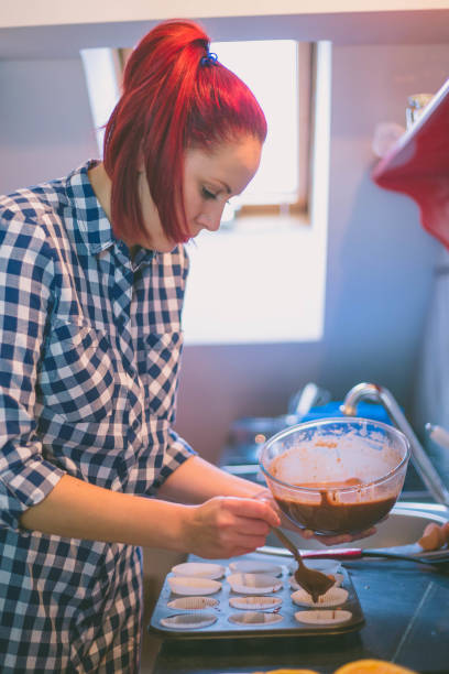 istock happy woman cooking on kitchen 963161514