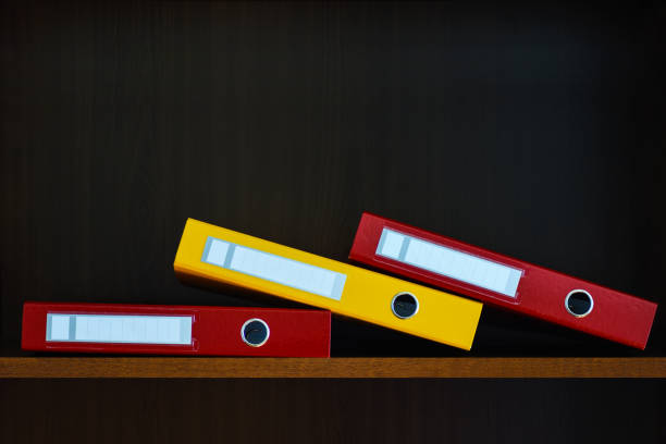 istock Folders for documents in the closet on the shelf in the office, files, copy space, background, close-up, office supplies 963171250