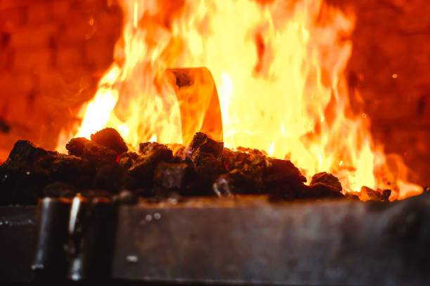 istock Fire in the furnace in the smithy, tools 963173820