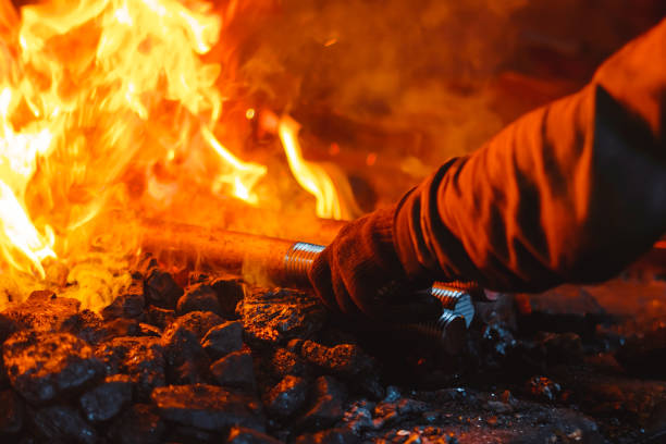 istock Fire in the furnace in the smithy, tools 963173900