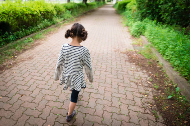 istock Girl playing in the park 963178068
