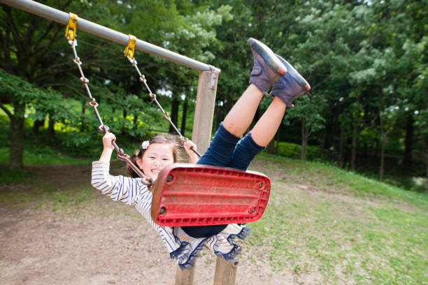 istock Girl playing in the park 963178106