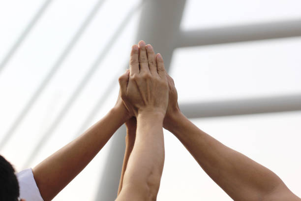 istock Friendship, Group people with stack of hands showing unity on white background, Meeting teamwork concept 963190206
