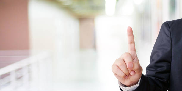 istock Businessman hand touching over blur office background, business background, banner 963190298