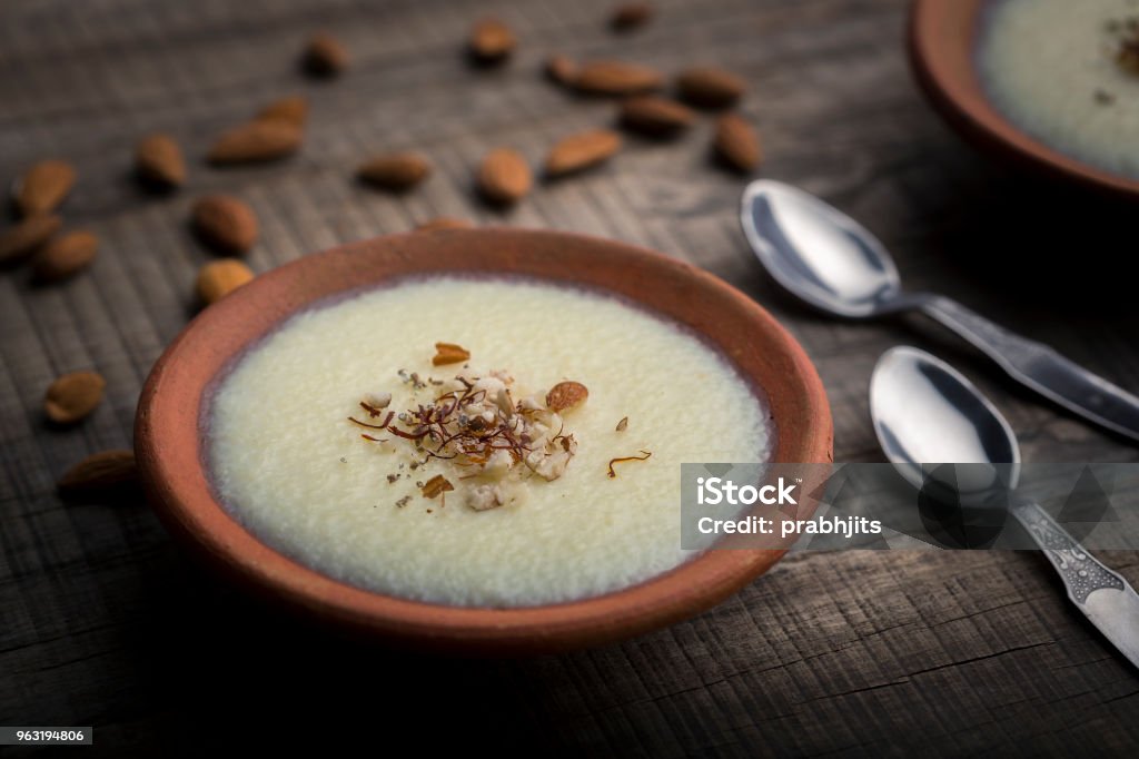 phirni - sweat rice pudding phirni - sweat rice pudding or dessert made with grinded rice , milk, sugar and nuts Almond Stock Photo