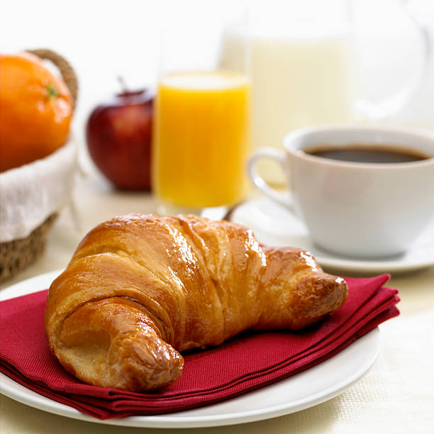 Continental breakfast coffee milk orange juice and croissant continental breakfast with milk coffee orange juice and brioche continental breakfast photos stock pictures, royalty-free photos & images