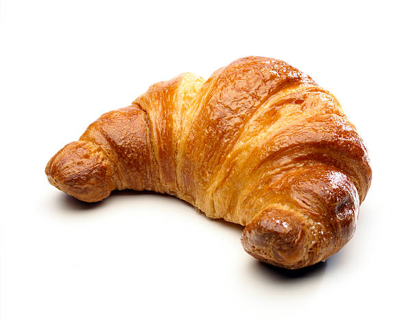 Cornetto bread against white background Cornetto (Croissant) isolated on white croissant stock pictures, royalty-free photos & images