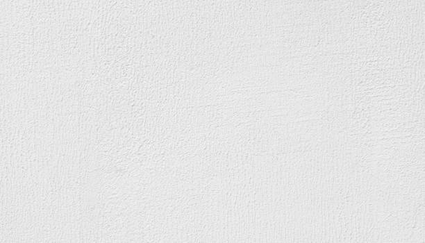 istock High detailed fragment of white painted stone wall. 963196186