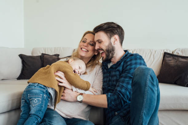 istock Toddler hugging happy parents 963196210