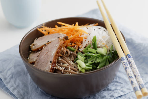 istock Duck breast with soba noodles and vegetables 963197112