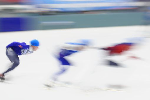 Motion blurred image of short track speed skating competitions