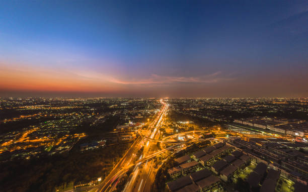 istock High Angle View Of Illuminated Buildings Against Sky During Sunset 963202220