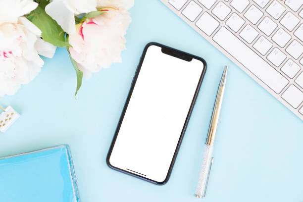 istock Home office desk with phone on blue 963205340