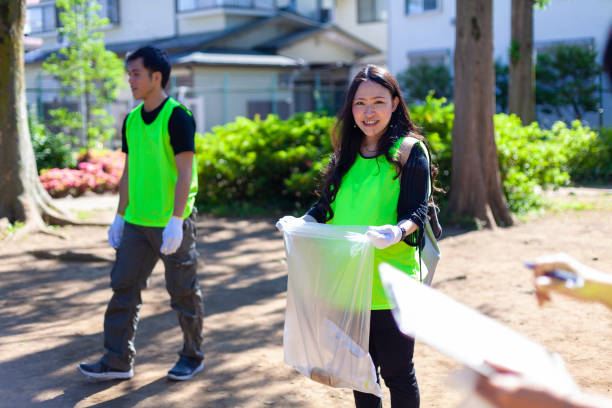 istock People cleaning public park in Tokyo 963205628