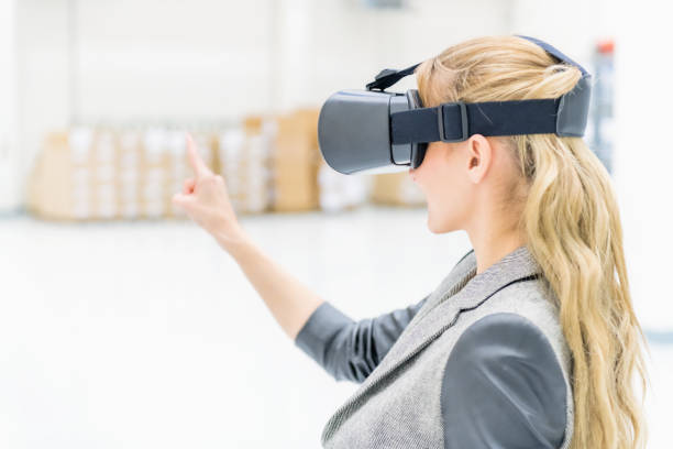 istock Virtual reality & rear view of woman manager 963211660
