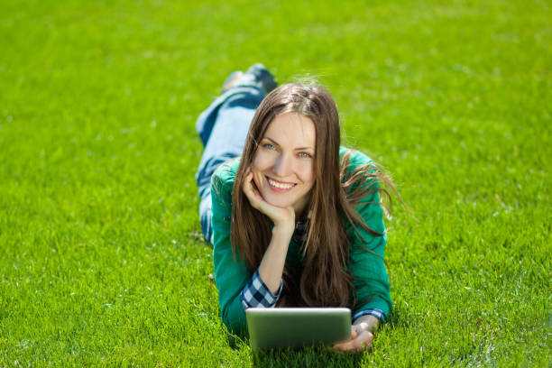 istock Young woman using tablet outdoor 963216746