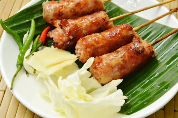 istock grilled Thai sausage stuffed rice and pork with fresh vegetable on plate 963238006
