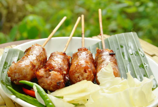 istock grilled Thai sausage stuffed rice and pork with fresh vegetable on plate 963238008