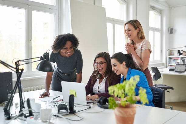 istock Surprised businesswomen using laptop at desk 963240136