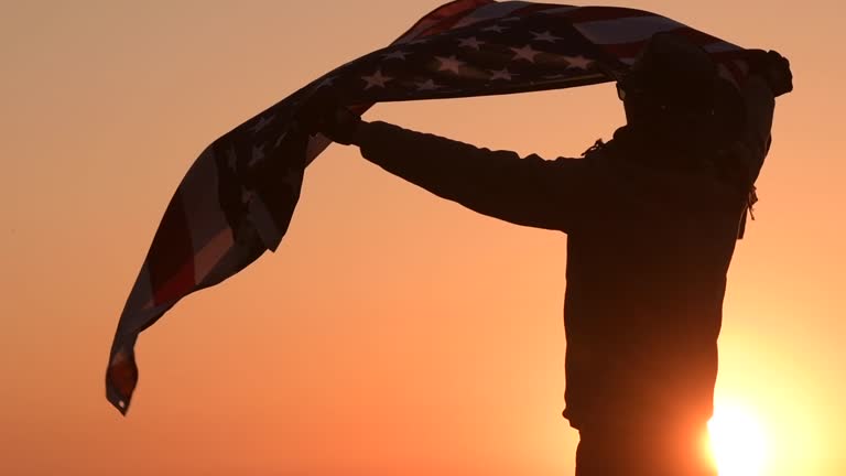 4th of July Celebration. Caucasian Cowboy with American Flag in Slow Motion