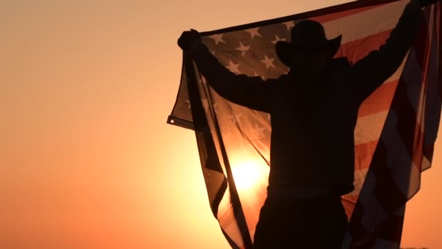 American Cowboy with United States of America National Flag in Slow Motion
