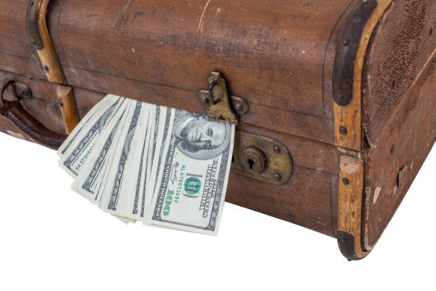 istock American one hundred dollar bills comming out from an old suitcase 963259660