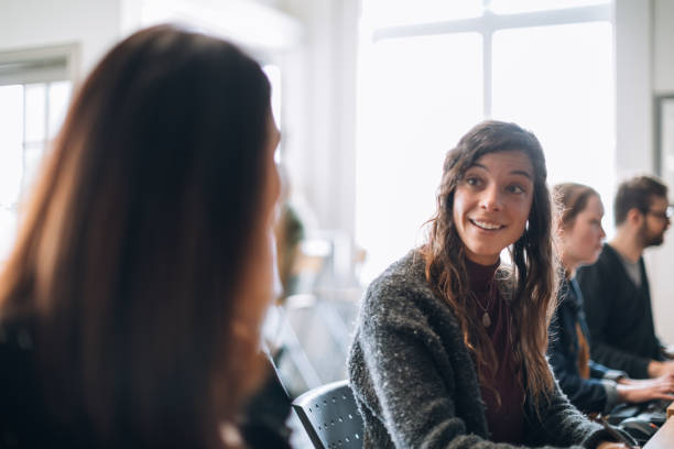 istock Two young women introducing in a community center 963269778