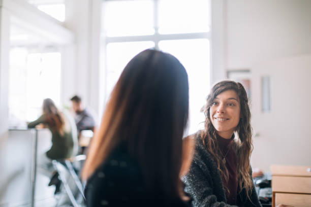istock Two young women introducing in a community center 963269980
