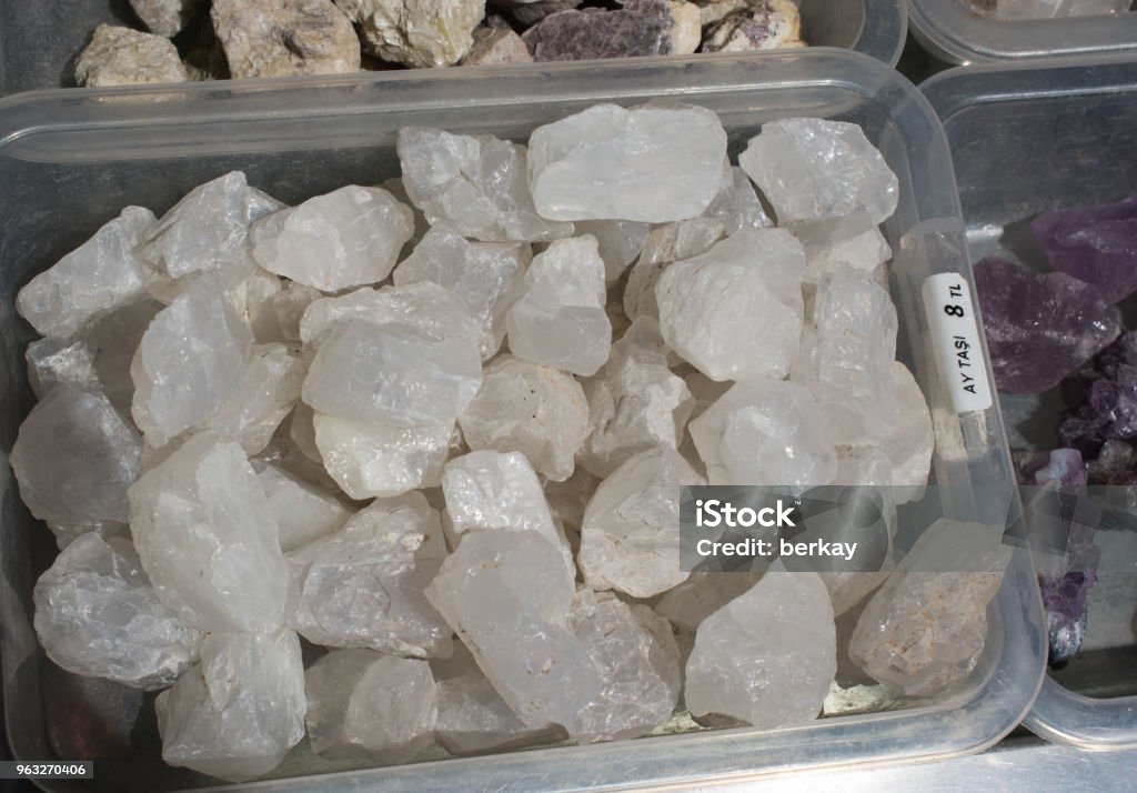 moonstone (adular) gem stone as natural mineral rock moonstone (adular) gem stone as natural mineral rock specimen Blue Stock Photo